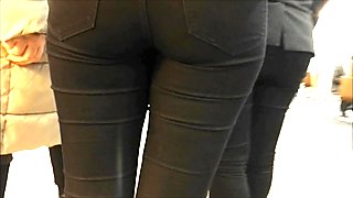 Teen ass in black jeans close filmed